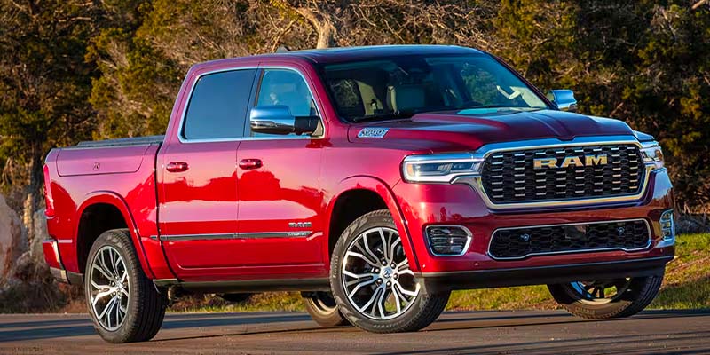 A shiny red 2019 Ram 1500 Limited Crew Cab pickup truck with chrome accents, angled front-left.